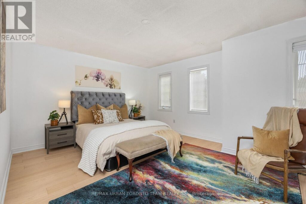 Cream bedroom staged with golden rust accents for warmth and appeal.